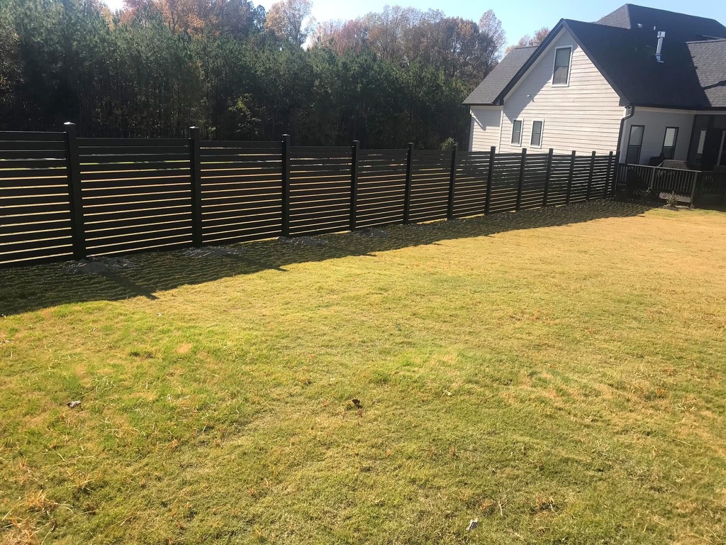 Black aluminum horizontal fence by MBK Fencing