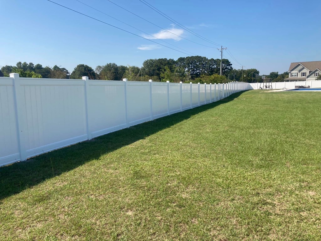 White vinyl privacy fence by MBK Fencing